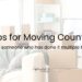 Moving boxes in a nearly-empty room, getting back up to start moving. Tips for Moving Countries on top.