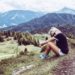 Woman sitting on a hiking trail. 6 things to do after university.