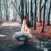 Woman with an umbrella walking away from the camera. 11-Reasons-a-Rainy-Day-is-Amazing