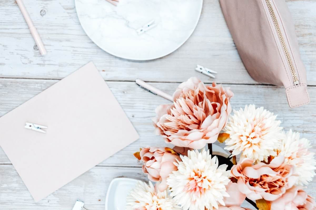 Flowers, pink notebook and marble dish on a wooden table. 'how to start a wordpress blog with Lyrical Host. This Splendid Shambles.