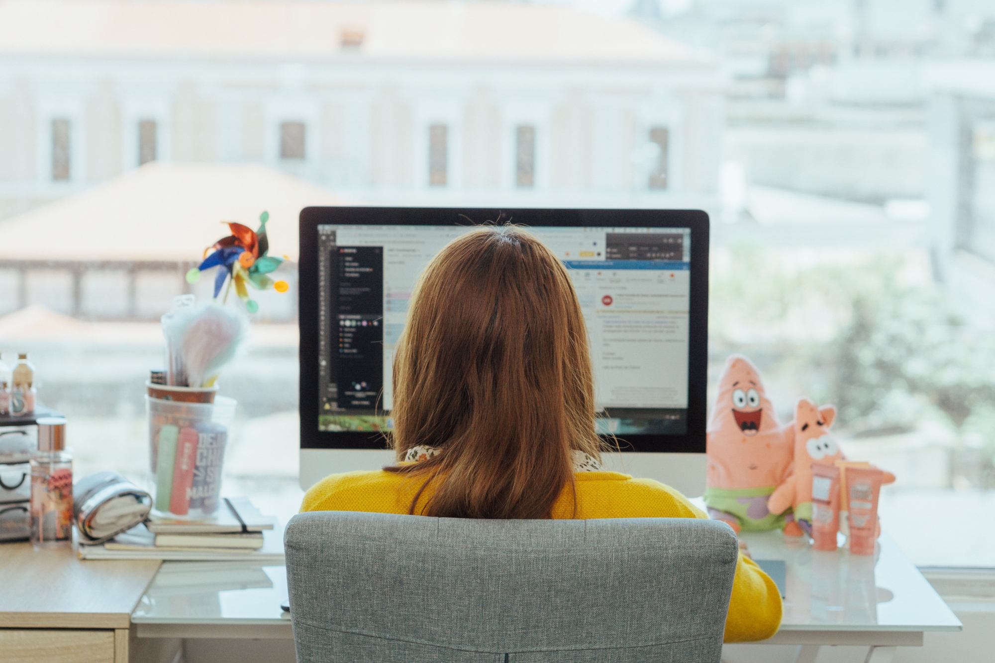 How to repurpose your blog content for email marketing. Woman at a computer desktop