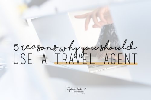 Laptop open on a desk, with a hand pointing at the screen. Low opacity white over the top, with the words '5 reasons why you should use a travel agent' in black over the top. This Splendid Shambles Blog.