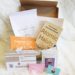 My Growth Coach subscription box on a white fluffy blanket.