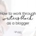 Woman sitting at a desk looking at a piece of paper. How to work through writer's block as a blogger - This Splendid Shambles.