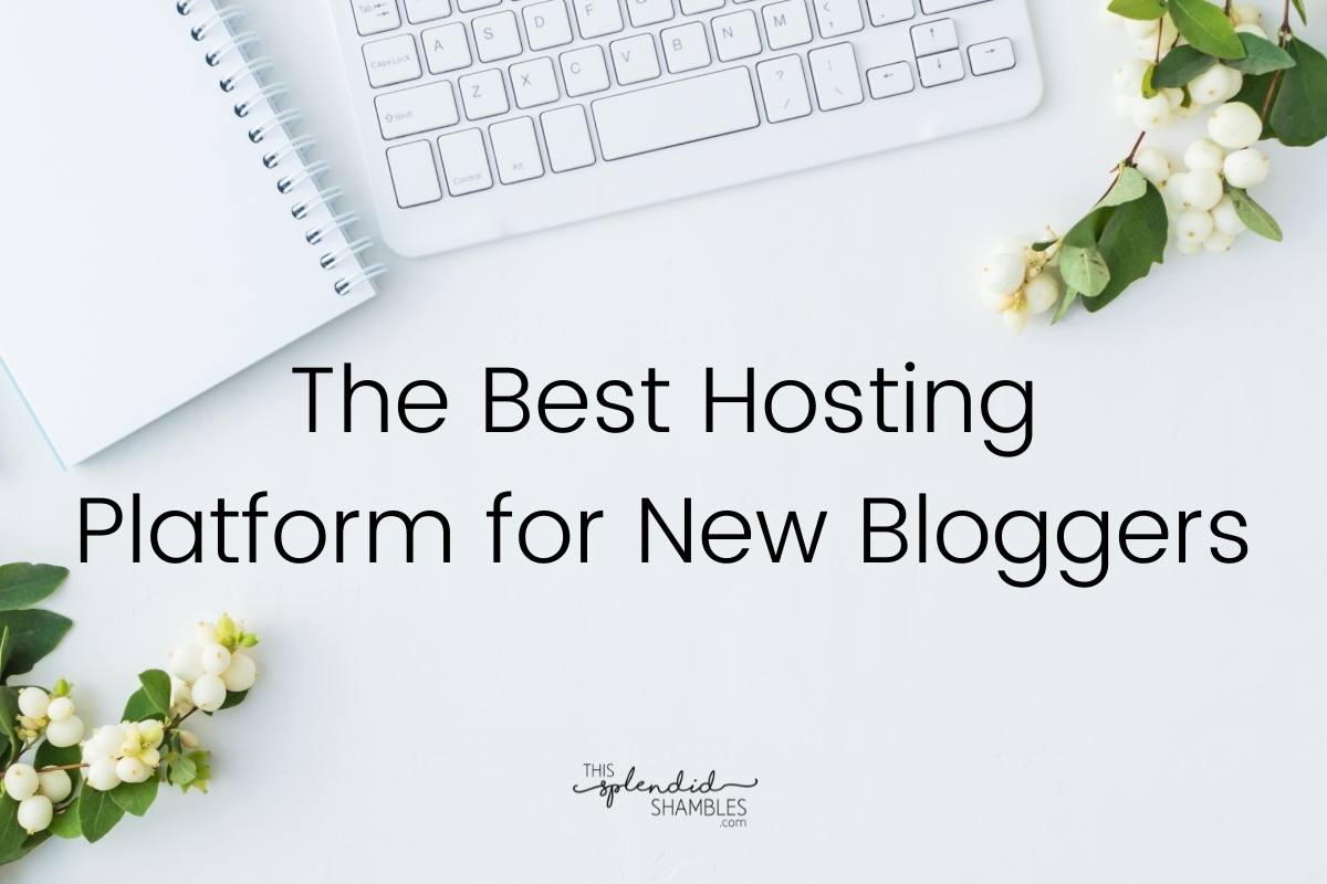 Flat lay of a desk with keyboard notebook and flowers. The best hosting platform for new bloggers - Lyrical Host - This Splendid Shambles