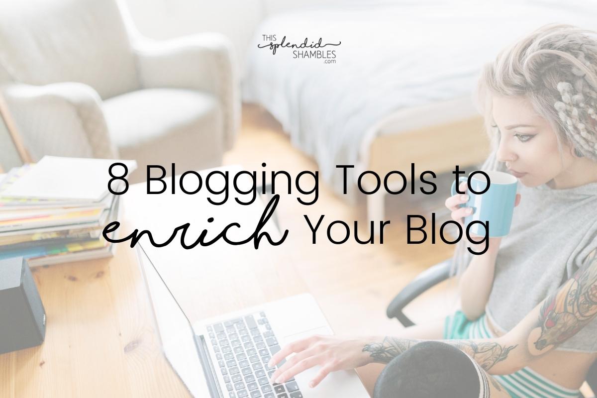 Woman with tattoos sitting at a desk sipping a hot drink, her knee up, her hand poised over a laptop on the desk. 8 Blogging Tools to Enrich Your Blog.