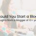 Anjali from This Splendid Shambles sitting on the floor with a laptop on a small table in front of her. 'Should you start a blog" written over the top.