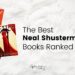 White fluffy blanket, with book covers of three Neal Shusterman books to the left. To the right has the text 'The Best Neal Shusterman Books Ranked by you"