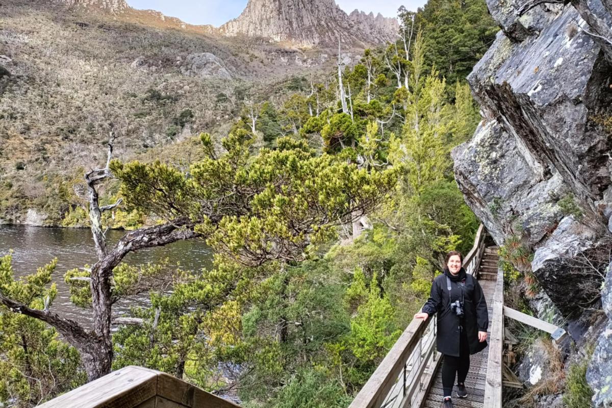 Anjali from This Splendid Shambles on a board walk overlooking Dove Lake at Cradle Mountain. 