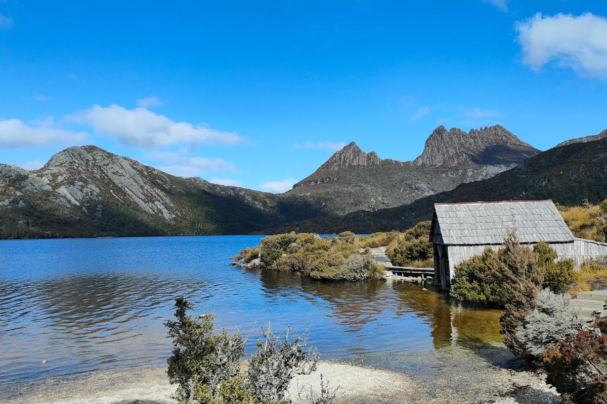 Dove Lake at Cradle Mountain, Tasmania, Australia. Wooden hut to the right, on the edge of the water.