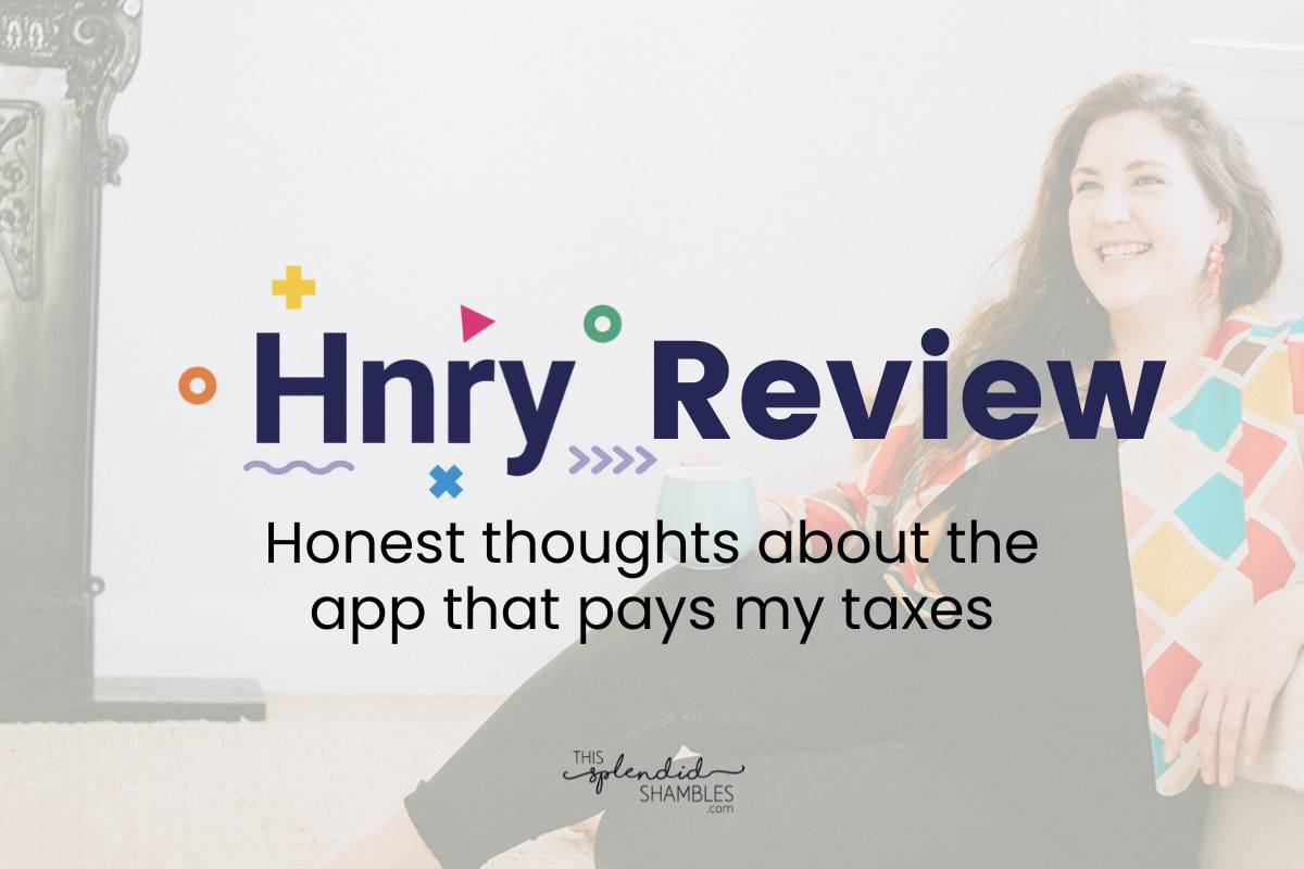 Anjali sitting on the floor with the words 'Hnry Review: honest thoughts about the app that pays my taxes" on This Splendid Shambles.